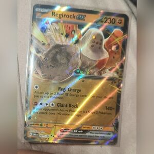 Pokemon Regirock GX Trading Card - Gold and Brown